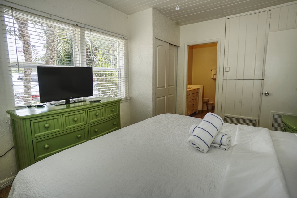 Wicker Inn Resort – Bougainvillea – Primary Bedroom – Left bed side view